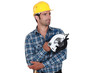 Man holding circular-saw