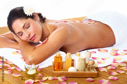 Photo: Young woman getting massage in spa salon. Young woman getting massage in spa salon.