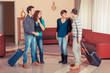 Group of People with Trolley in the Hall