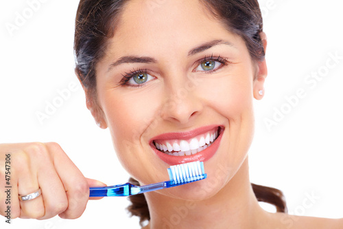 Photo: Beautiful woman smile with a toothbrush. Beautiful woman smile with a toothbrush.