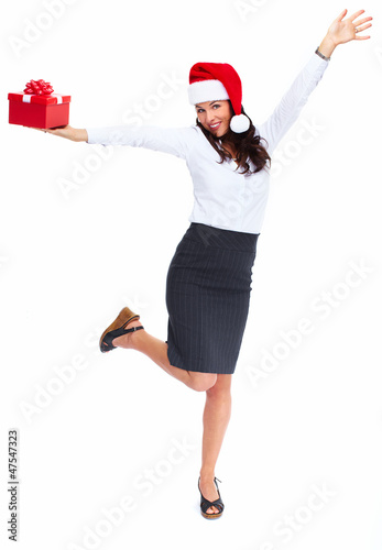 Photo: Santa helper business woman with a present. Santa helper business woman with a present.