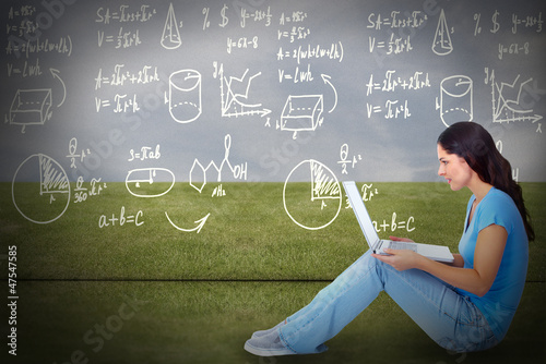 Photo: Young woman with laptop computer. Young woman with laptop computer.