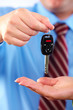 Hand with a car key.