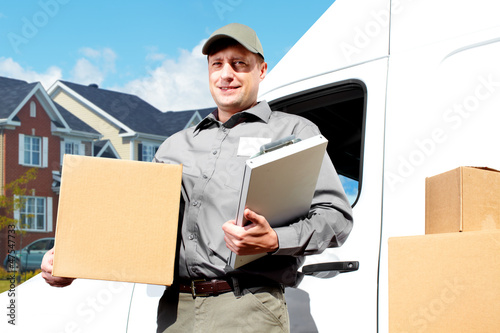 Photo: Delivery postal service man. Delivery postal service man.