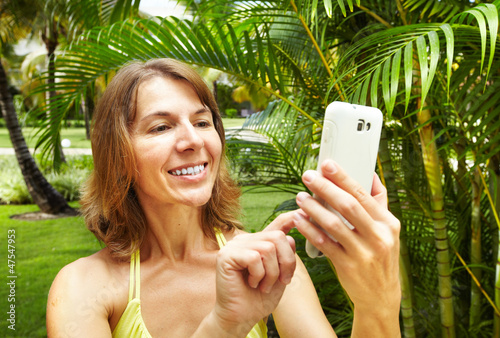 Photo: Woman with a smartphone. Woman with a smartphone.