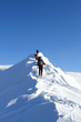 Hiker in winter mountains snowshoeing