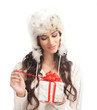 Portrait of a young woman holding a Christmas present