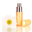 Women's perfume in beautiful bottle with flower isolated