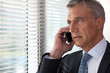 Executive phone in front of window