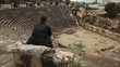 Video: Man sitting on the stone chair in ancient amphitheater Myra Man sitting on the stone chair in ancient amphitheater Myra