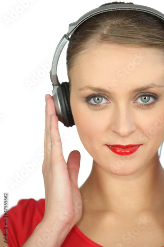 Photo: Close-up shot of a woman listening to music Close-up shot of a woman listening to music