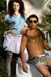 couple young male model with snake in tropical green forest