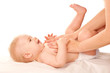 Photo: Baby massage. Mother massaging kid belly, baby laughing. Baby massage. Mother massaging kid belly, baby laughing.