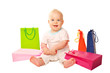 Photo: Baby shopping. Happy kid with shopping bags. Baby shopping. Happy kid with shopping bags.