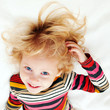 Photo: Happy child. Selective focus on the eyes of kid. Happy child. Selective focus on the eyes of kid.