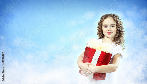 Photo: Happy girl opening gift box Happy girl opening gift box
