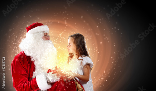 Photo: portrait of santa claus with a girl portrait of santa claus with a girl