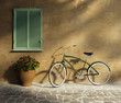 Tuscan stucco wall, doorway antique romantic vintage bicycle