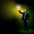 Businessman with light shining