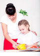 mom and daughter cooking together