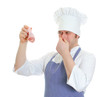 Chef cook holding rotten chicken leg. Isolated on white