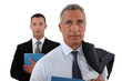 businessman and his assistant posing together