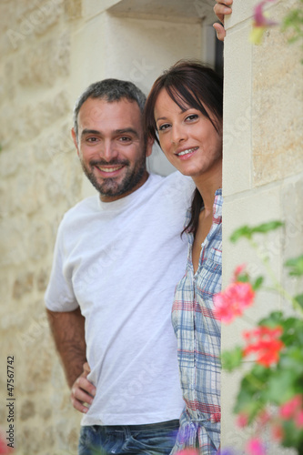 Photo: Couple standing in a doorway Couple standing in a doorway