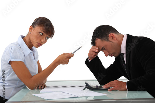Photo: Woman scolding an ashamed man Woman scolding an ashamed man