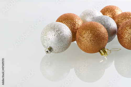 Photo: Christmas baubles reflected on glass with copy space Christmas baubles reflected on glass with copy space