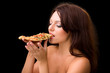 young woman eating a piece of pizza