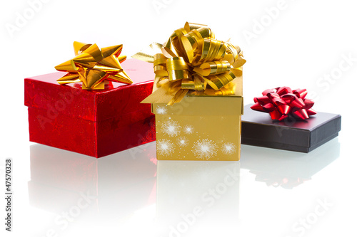 Photo: Christmas present boxes over white background Christmas present boxes over white background