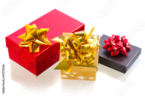 Photo: Christmas present boxes over white background Christmas present boxes over white background