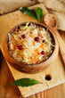 sauerkraut - Sour cabbage -  on wooden bowl with bay leaves