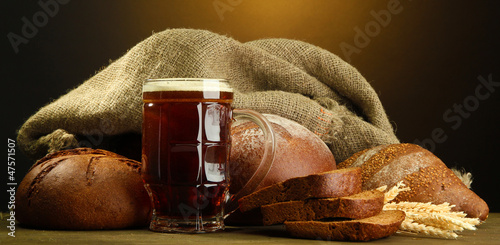 Photo: tankard of kvass and rye breads with ears, tankard of kvass and rye breads with ears,
