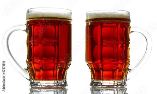Photo: two tankards of kvass, isolated on white two tankards of kvass, isolated on white