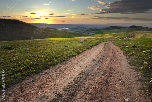 Photo: Dirt Road In Meadow At Daybreak Dirt Road In Meadow At Daybreak