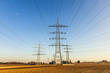 hight voltage tower in rural landscape with blue sky