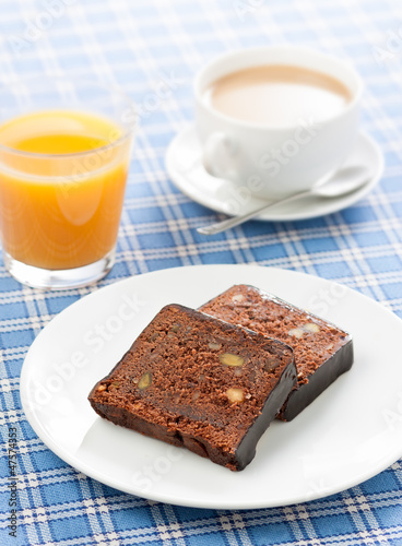 Photo: Breakfast with coffee, orange juice and chocolate cake Breakfast with coffee, orange juice and chocolate cake
