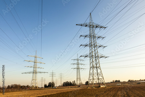 Photo: hight voltage tower in rural landscape with blue sky hight voltage tower in rural landscape with blue sky