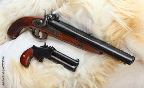 Photo: Vintage large-bore pistols. British colonial weapons. Vintage large-bore pistols. British colonial weapons.