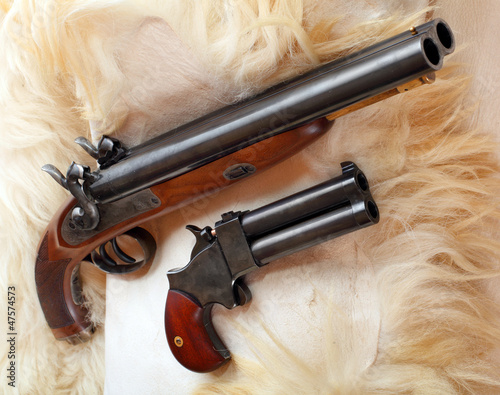 Photo: Vintage large-bore pistols. British colonial weapons. Vintage large-bore pistols. British colonial weapons.