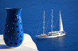Santorini island with sailboat in Greece