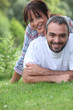 Couple lying on the grass