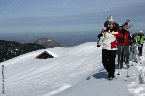 Photo: Group of skiers walking through the snow Group of skiers walking through the snow