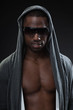 Black fitness man urban style with dark sunglasses. Studio shot.