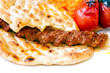 Foto: Traditional Adana Kebab served with pita bread Traditional Adana Kebab served with pita bread