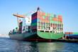 Green cargo ship in seaport