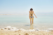 Young woman going to water