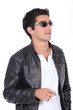 young man wearing leather jacket and sunglasses