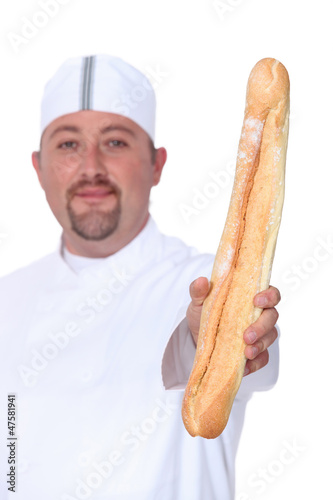 Photo: baker holding bread baker holding bread